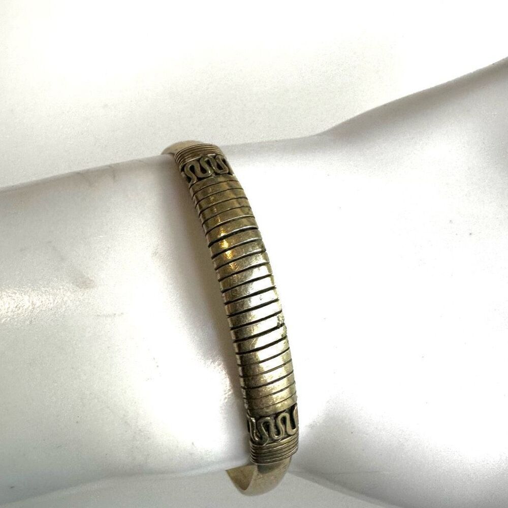 Gold tone etched open cuff bracelet